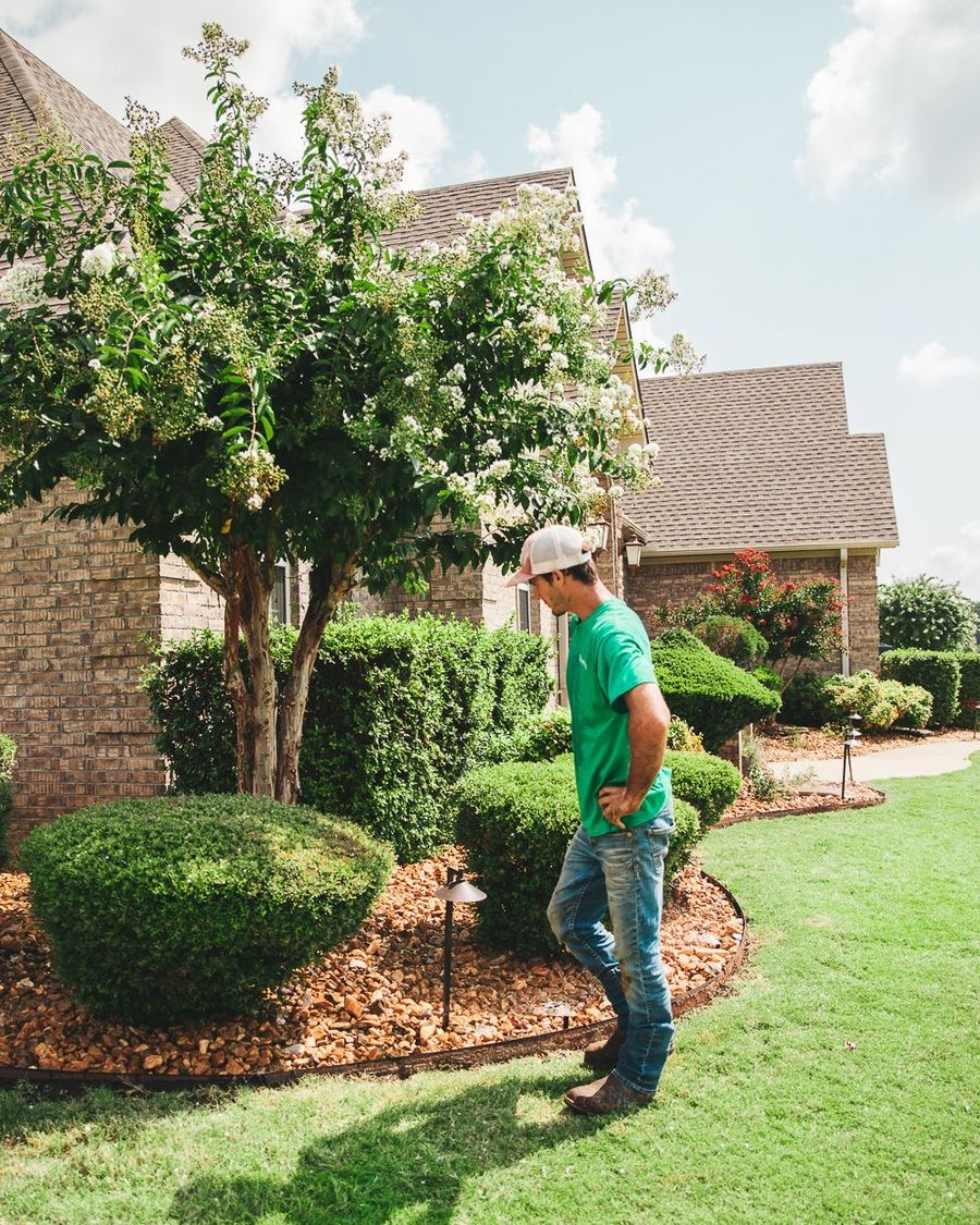Hardscaper walking a finished landscape bed